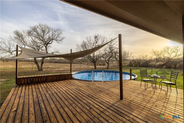 a view of swimming pool with seating space