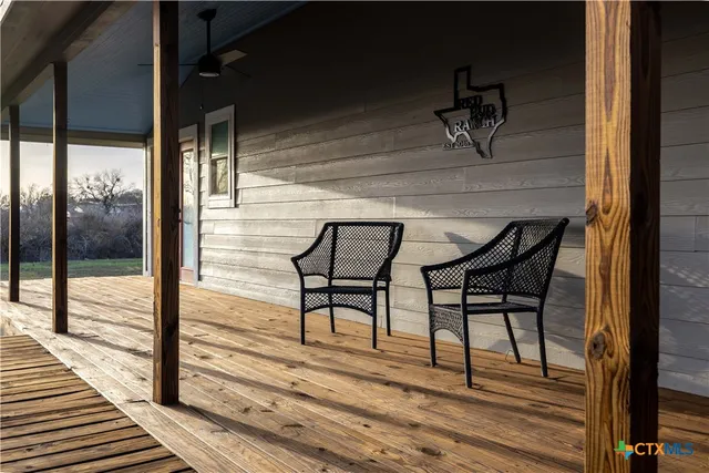 a view of a balcony table and chairs