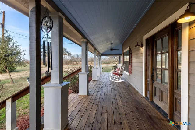 a view of a balcony with wooden floor