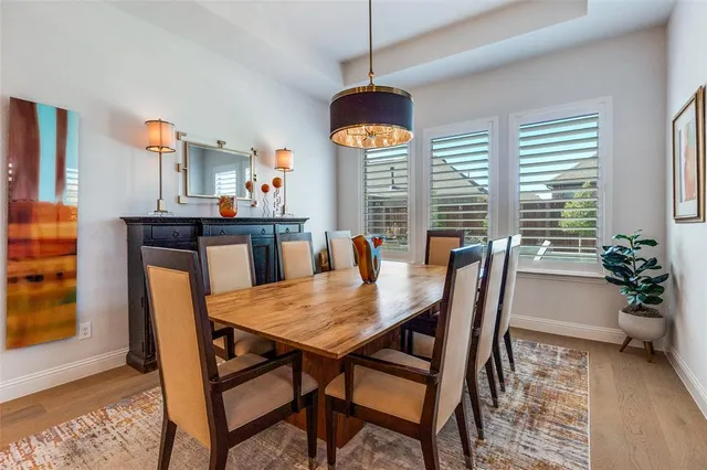 a view of a dining room with furniture and window