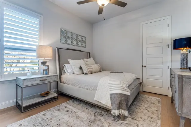 a bed room with a bed and a lamp