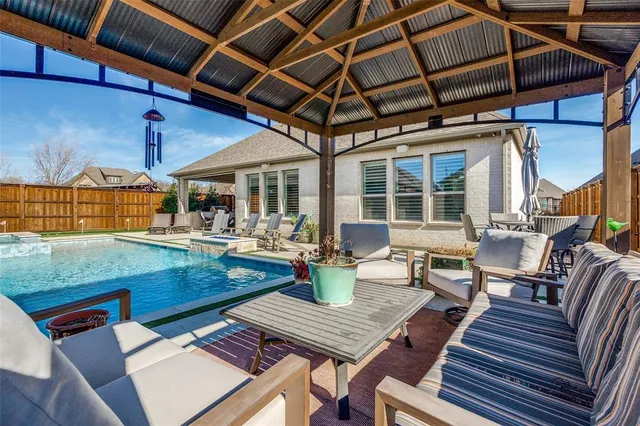 a building outdoor space with patio furniture and potted plants