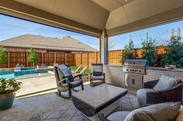 a view of an chairs and table in the patio
