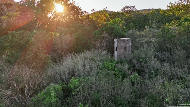 a aerial view of a house with a yard