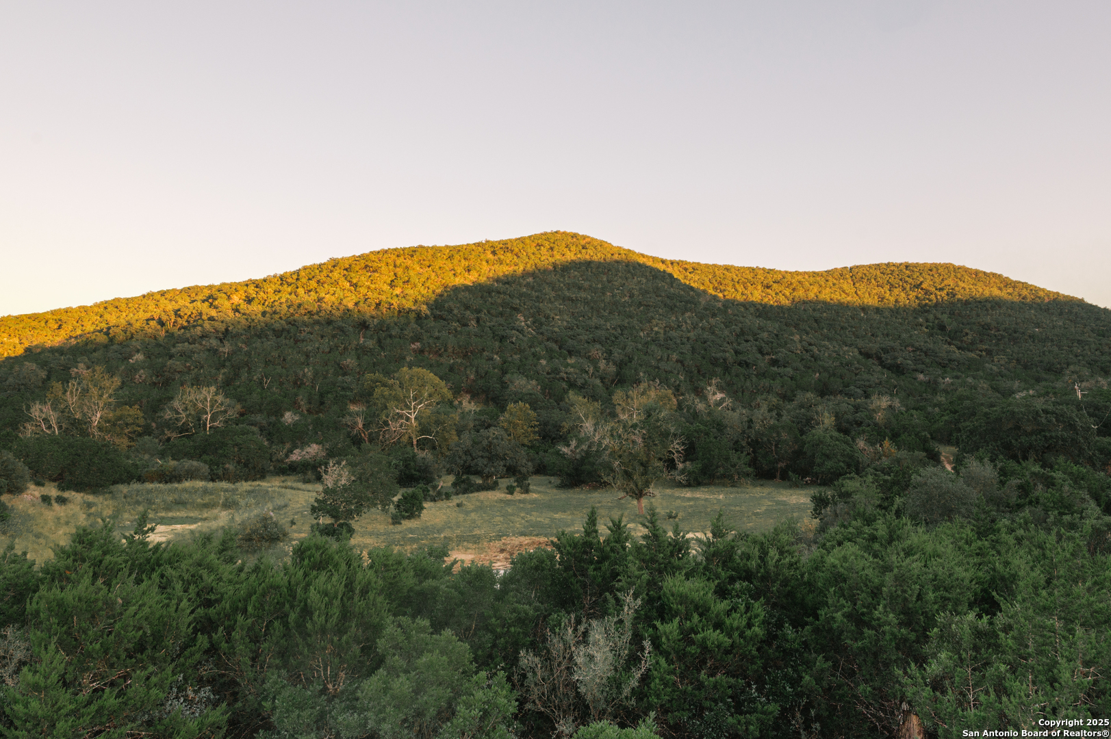 2581 Patterson Creek Road Leakey, TX 78873 - Photo 3 of 42 a view of a mountain range with lush green forest