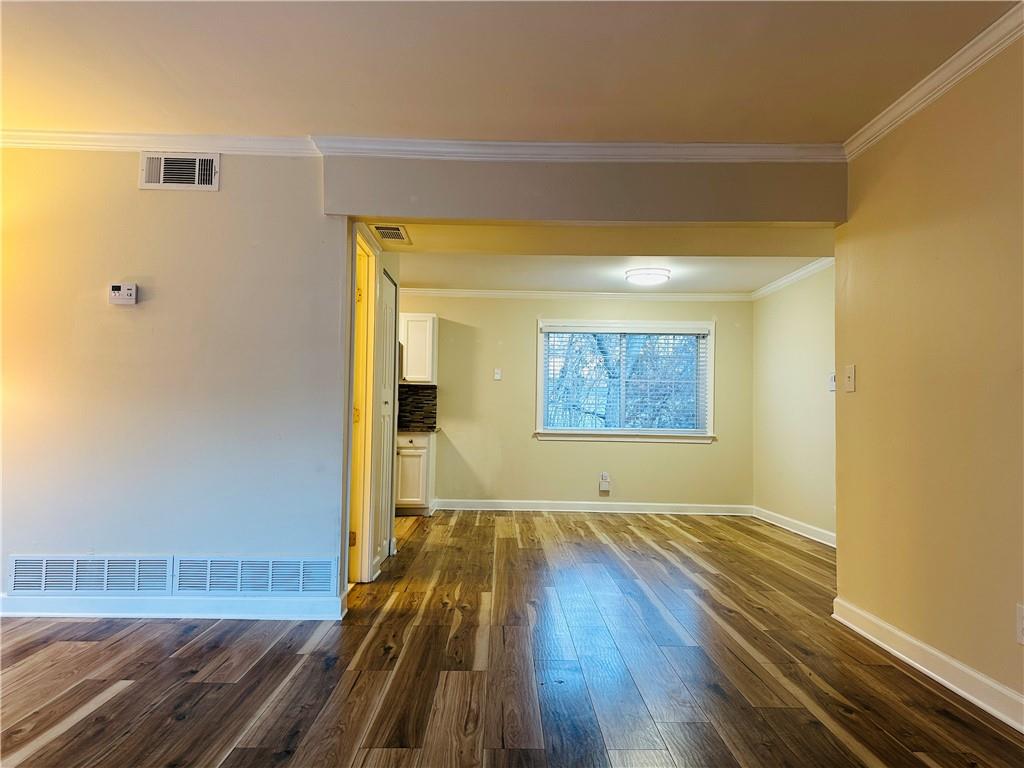 405 Fairburn Road Southwest, Unit 122 Atlanta, GA 30331 - Photo 1 of 26 a view of a room with wooden floor and a ceiling fan