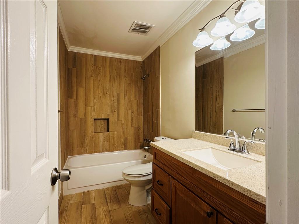 405 Fairburn Road Southwest, Unit 122 Atlanta, GA 30331 - Photo 18 of 26 a bathroom with a sink a toilet and shower