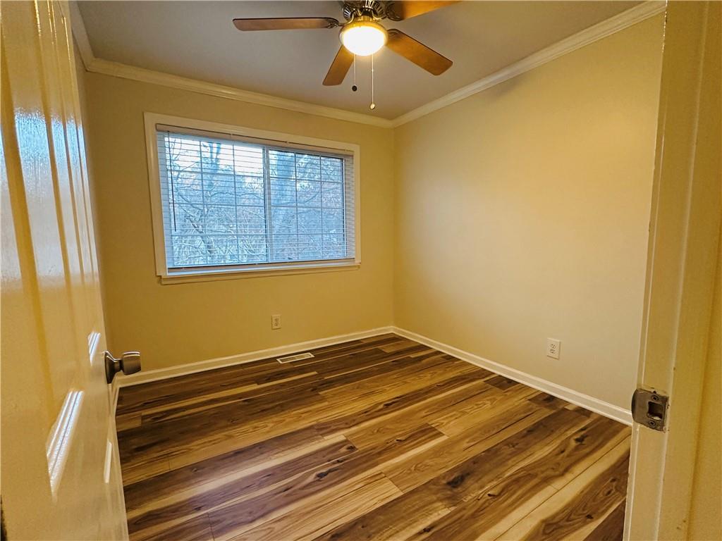405 Fairburn Road Southwest, Unit 122 Atlanta, GA 30331 - Photo 19 of 26 a bathroom with a window and a chandelier