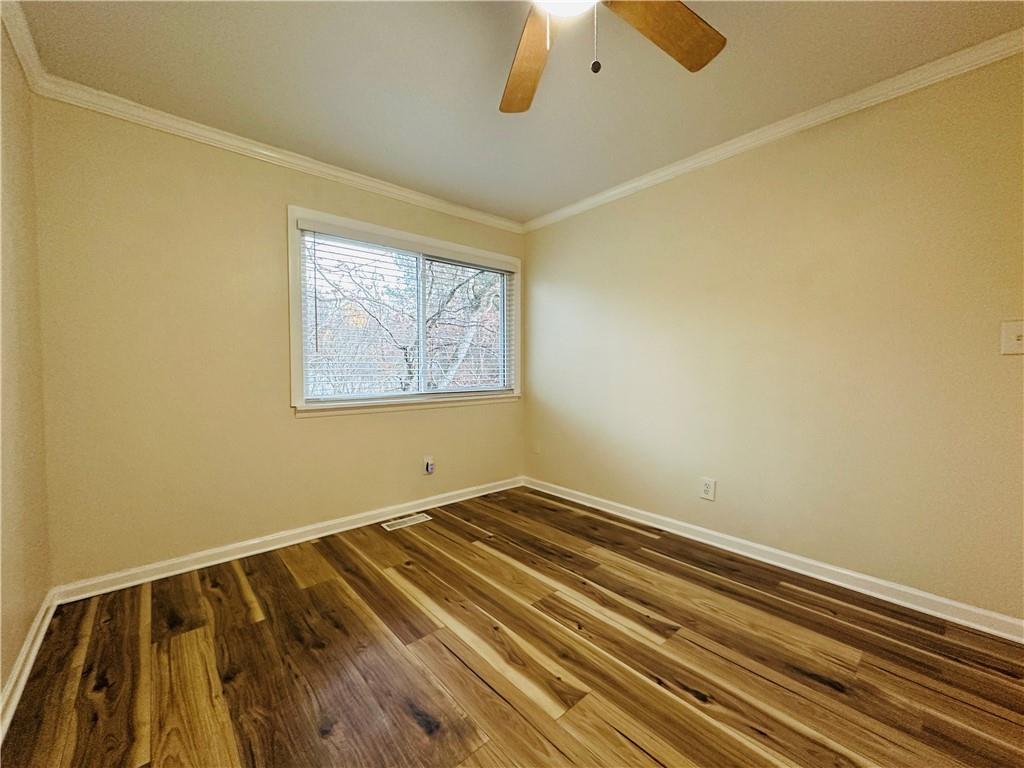 405 Fairburn Road Southwest, Unit 122 Atlanta, GA 30331 - Photo 21 of 26 a view of a room with wooden floor and a window