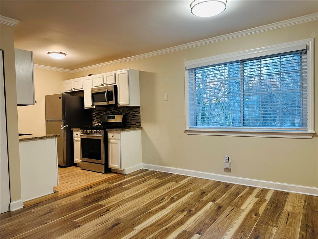 405 Fairburn Road Southwest, Unit 122 Atlanta, GA 30331 - Photo 3 of 26 a view of kitchen and microwave