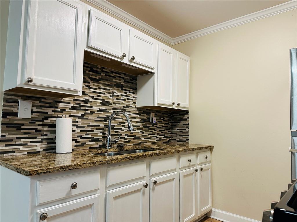 405 Fairburn Road Southwest, Unit 122 Atlanta, GA 30331 - Photo 6 of 26 a kitchen with a sink and cabinets