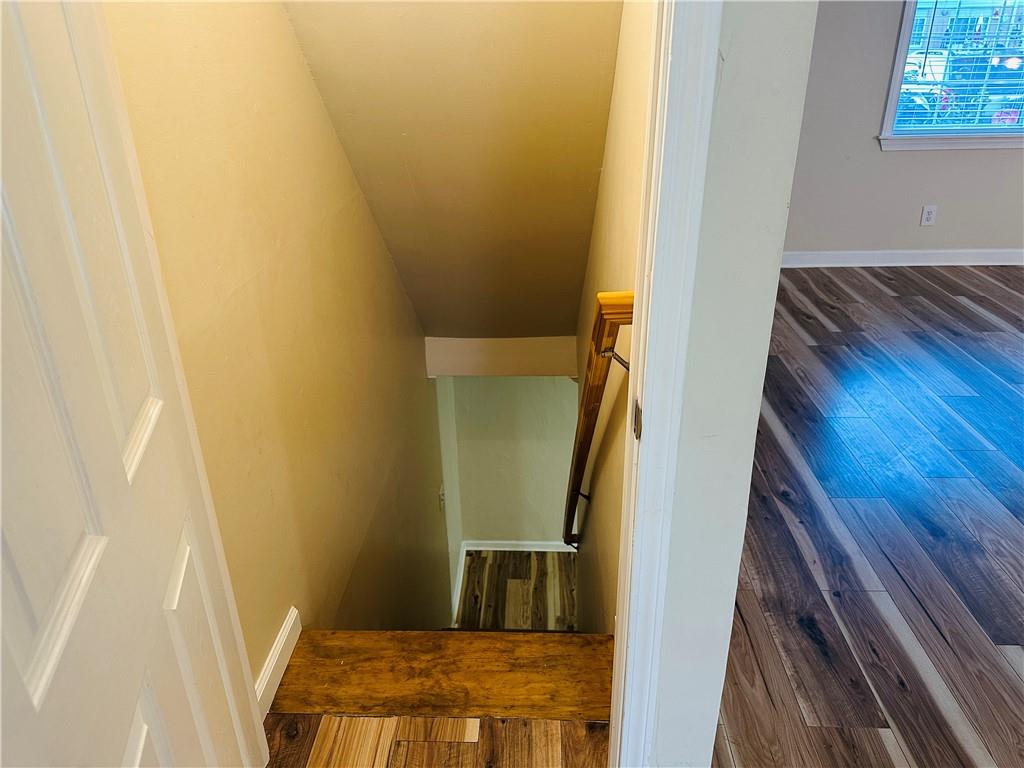 405 Fairburn Road Southwest, Unit 122 Atlanta, GA 30331 - Photo 10 of 26 a view of hallway with wooden floor