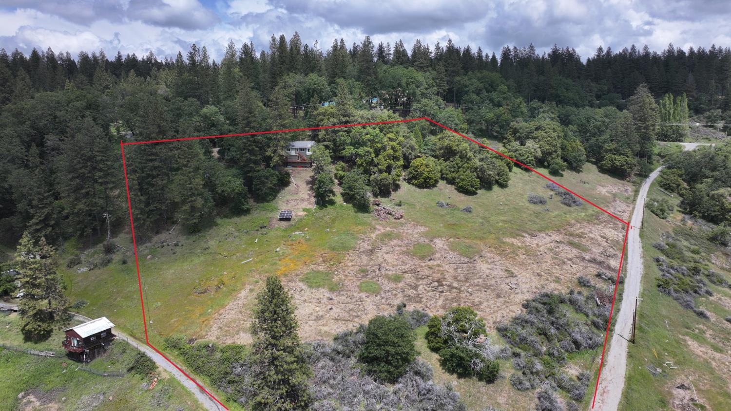 4850 8 Mile Road Camino, CA 95709 - Photo 20 of 30 a view of a forest with a lake
