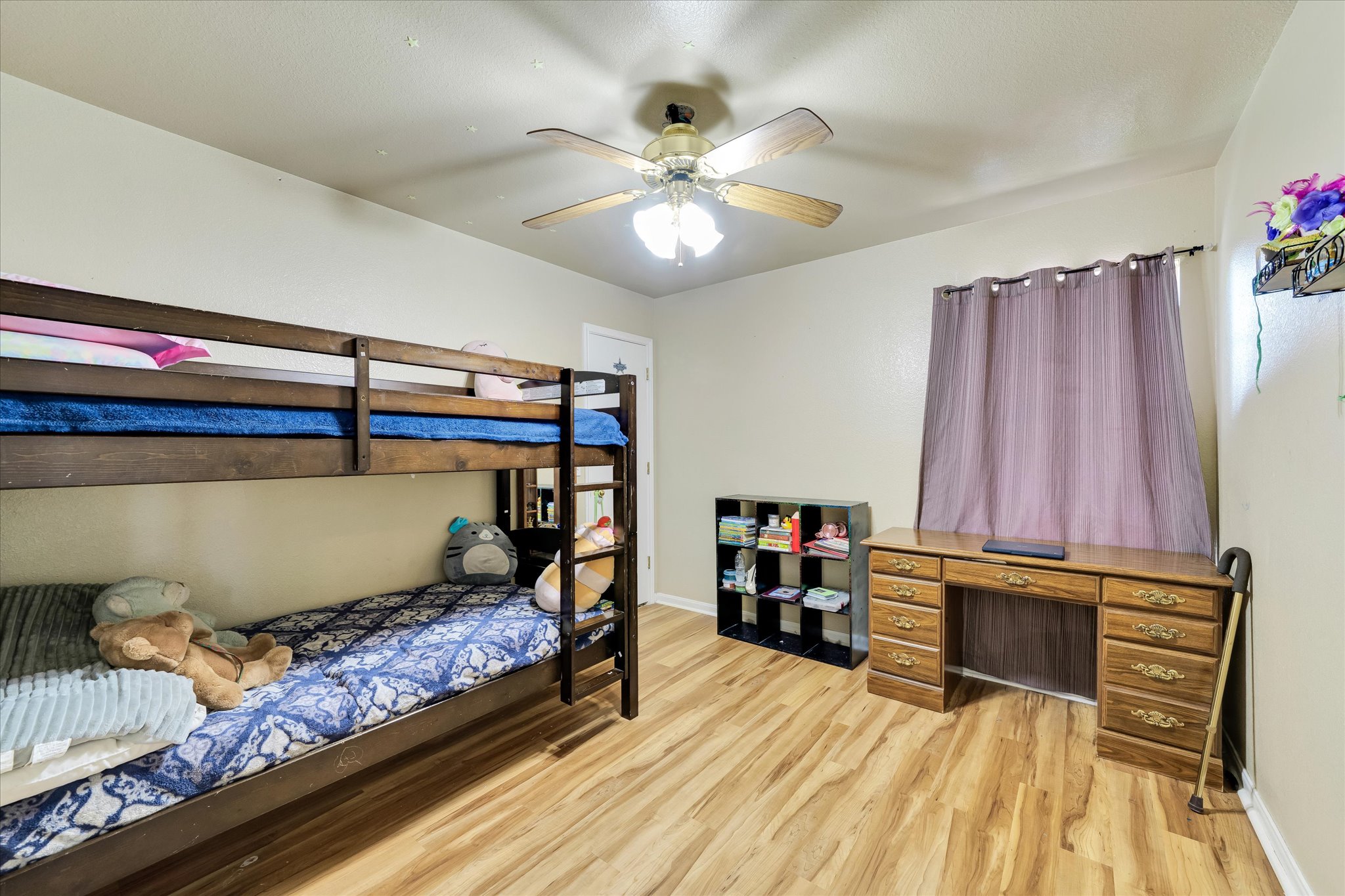 2601 Highcloud Drive Lockhart, TX 78644 - Photo 24 of 30 a bedroom with a bed and a chandelier