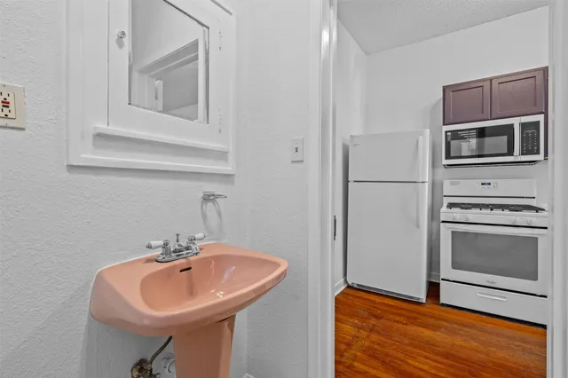 a kitchen with a sink and a microwave