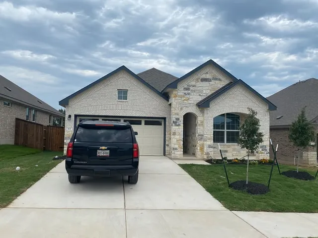 a house view with a garden space