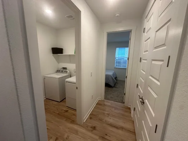 a view of a bathroom from a hallway