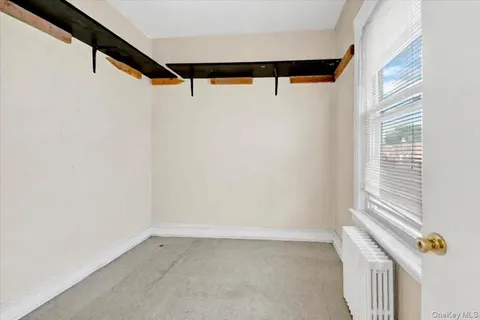 a view of walk in closet with window