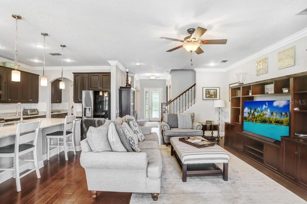 11719 Albatross Lane Riverview, FL 33569 - Photo 18 of 51 a living room with furniture a ceiling fan and a rug