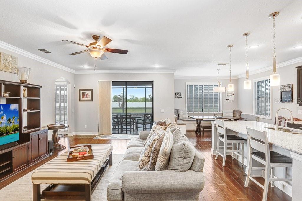 11719 Albatross Lane Riverview, FL 33569 - Photo 20 of 51 a living room with furniture kitchen view and a large window