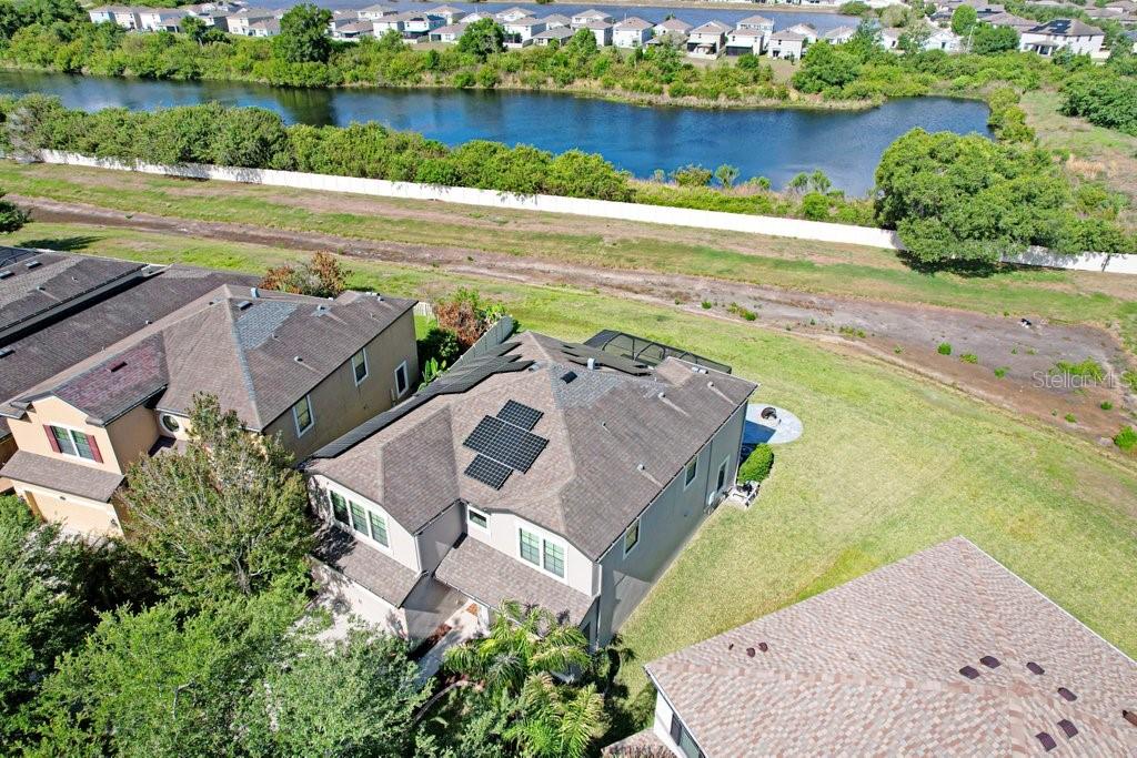 11719 Albatross Lane Riverview, FL 33569 - Photo 46 of 51 an aerial view of a house with a garden and lake view