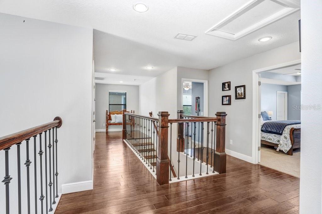11719 Albatross Lane Riverview, FL 33569 - Photo 7 of 51 a view of a hallway with wooden floor and windows