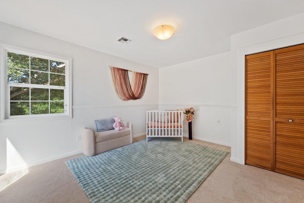 277 Wheelock Road Watsonville, CA 95076 - Photo 27 of 47 a bedroom with a bed and a window