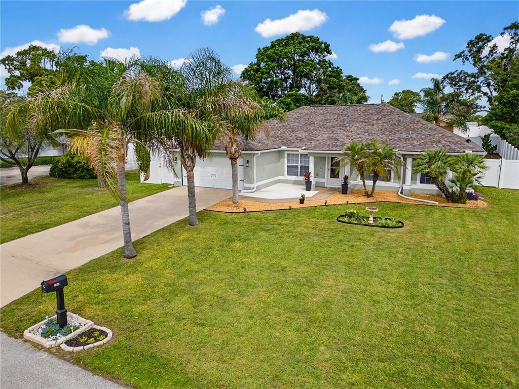 3497 Chadwick Avenue Spring Hill, FL 34609 - Photo 2 of 47 a view of a house with a yard porch and sitting area