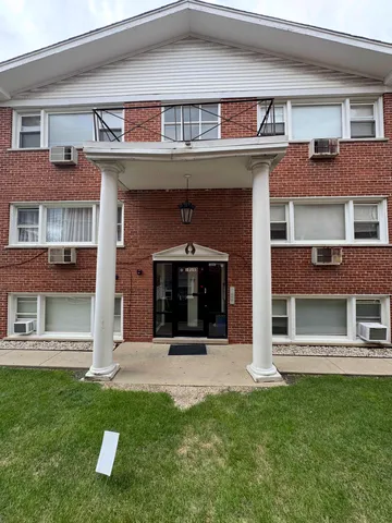 front view of a building with a yard