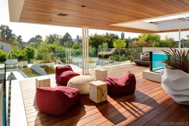 a outdoor space with patio the couches and dining table with a garden view