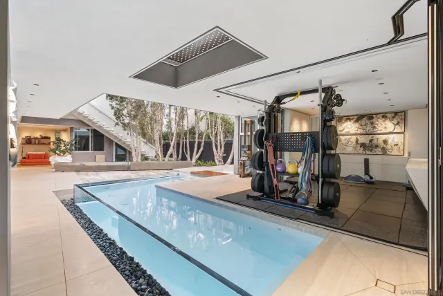 a view of a living room and bathroom