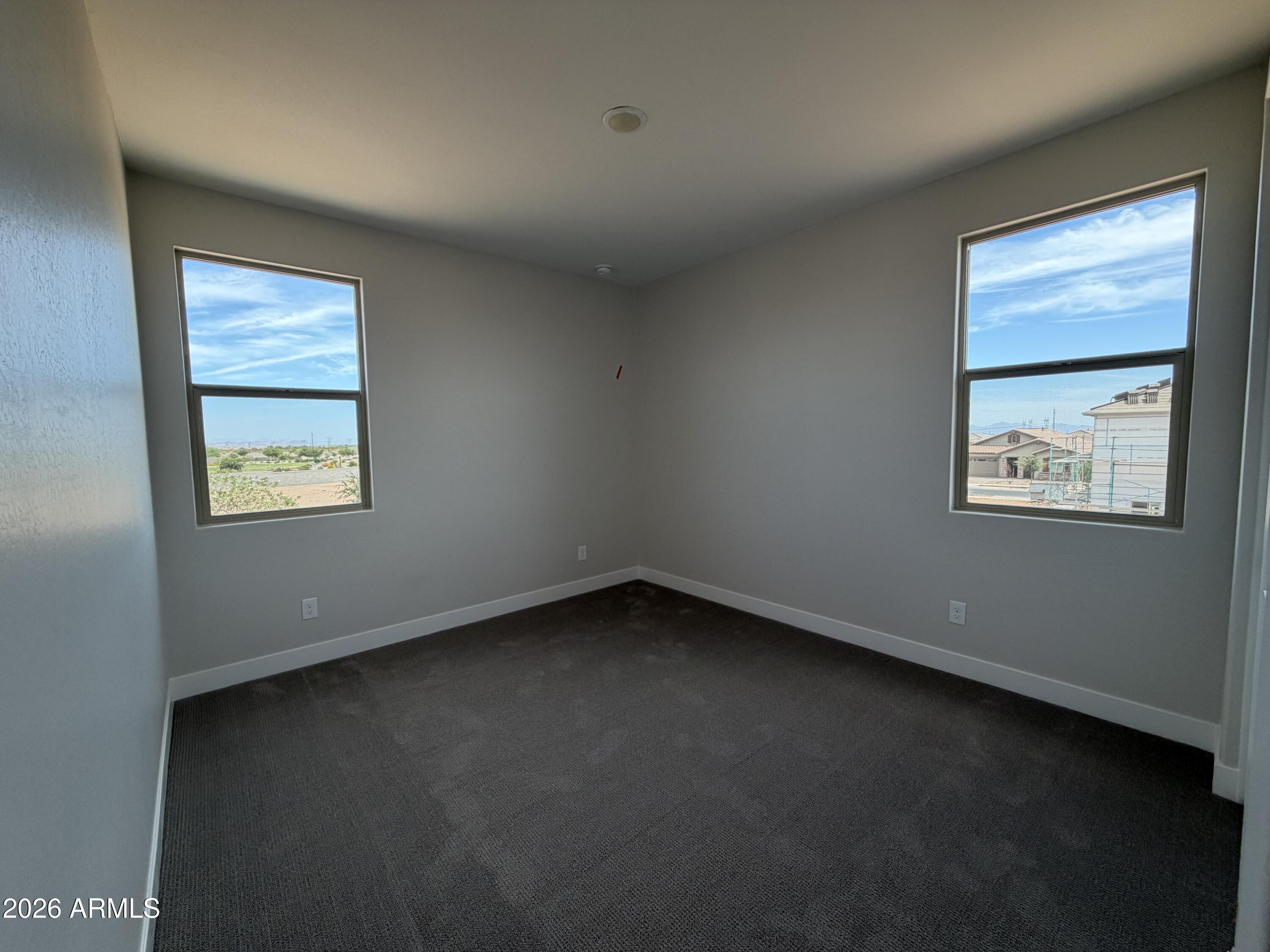 15767 West Sand Hills Road Surprise, AZ 85387 - Photo 22 of 60 an empty room with a window