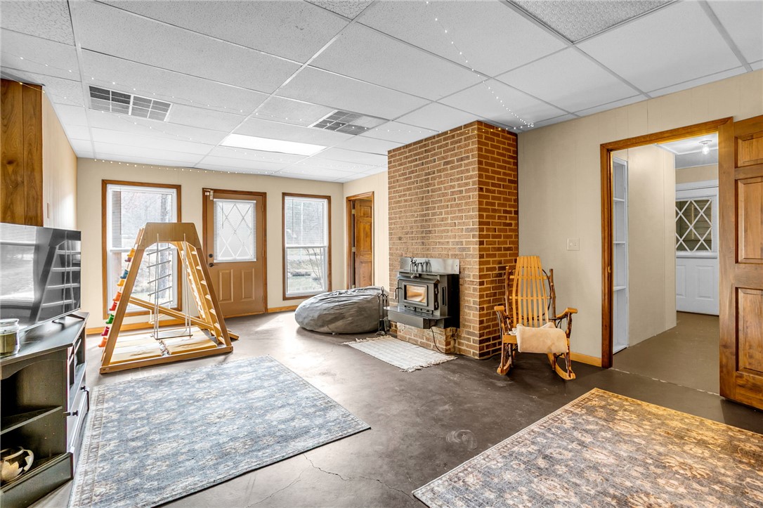 130 Greenbrier Road Salem, SC 29676 - Photo 12 of 42 This spacious living area offers a warm fireplace, creating an inviting and cozy atmosphere.
