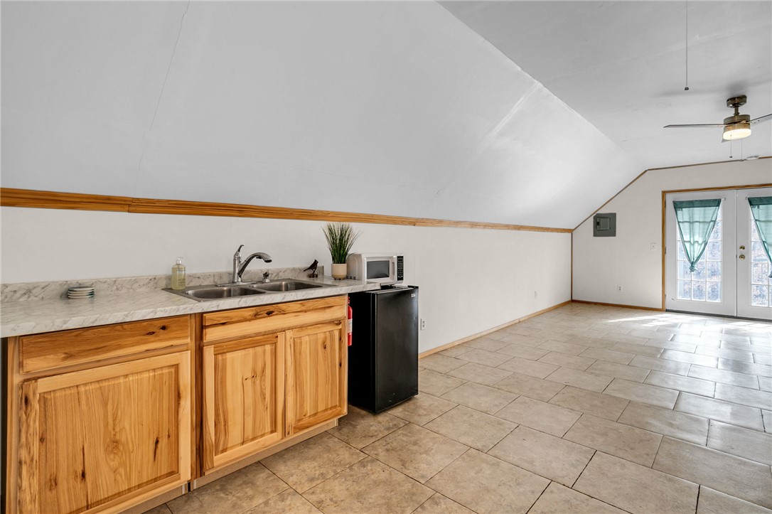 130 Greenbrier Road Salem, SC 29676 - Photo 17 of 42 This bright space features a convenient kitchenette, durable tile flooring, and direct outdoor access.