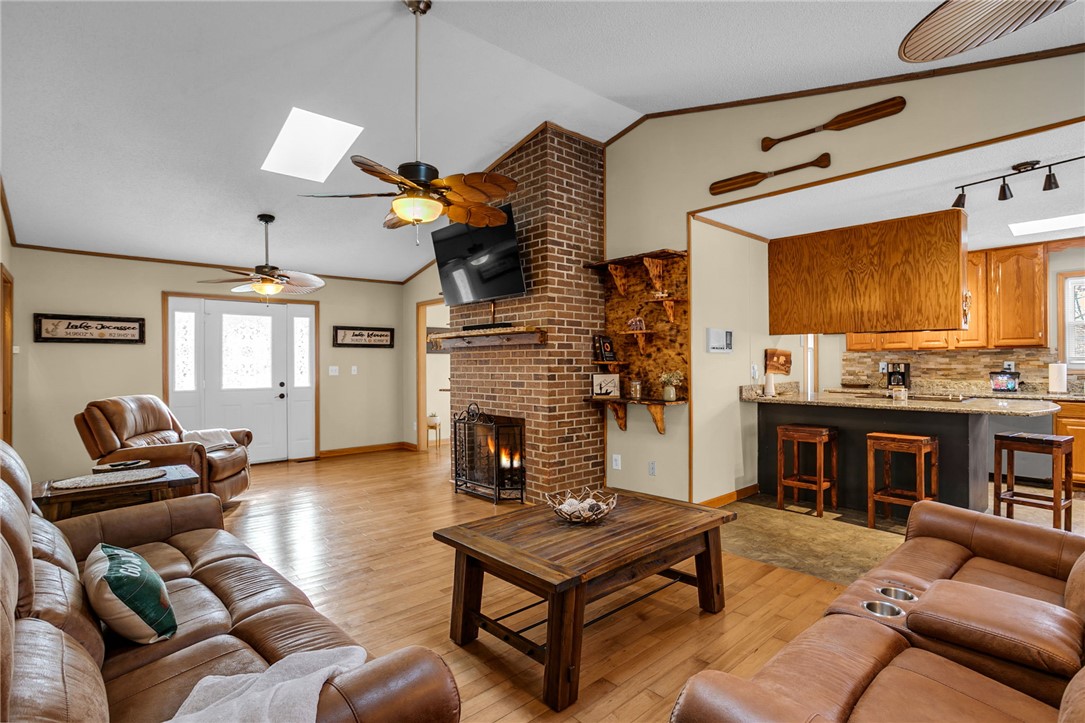 130 Greenbrier Road Salem, SC 29676 - Photo 3 of 42 This inviting space features an open layout with a kitchen, living area, and fireplace.