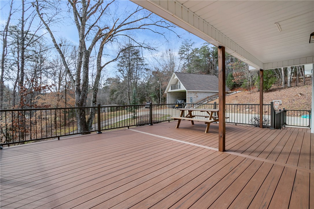 130 Greenbrier Road Salem, SC 29676 - Photo 6 of 42 This outdoor deck provides ample space for relaxation and enjoyment of the natural surroundings.