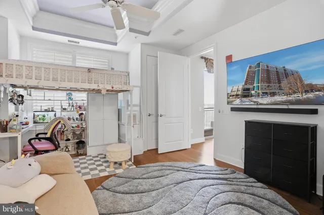 a living room with furniture a rug and white walls