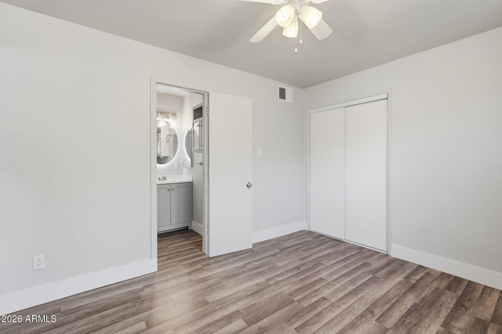 2206 West Rancho Drive Phoenix, AZ 85015 - Photo 16 of 29 a view of empty room with wooden floor