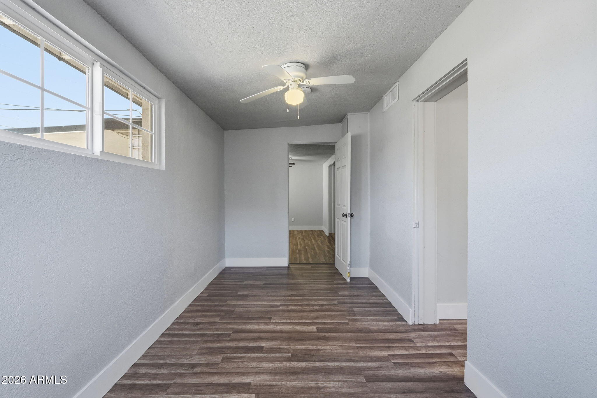 2206 West Rancho Drive Phoenix, AZ 85015 - Photo 20 of 29 a view of a hallway with wooden floor
