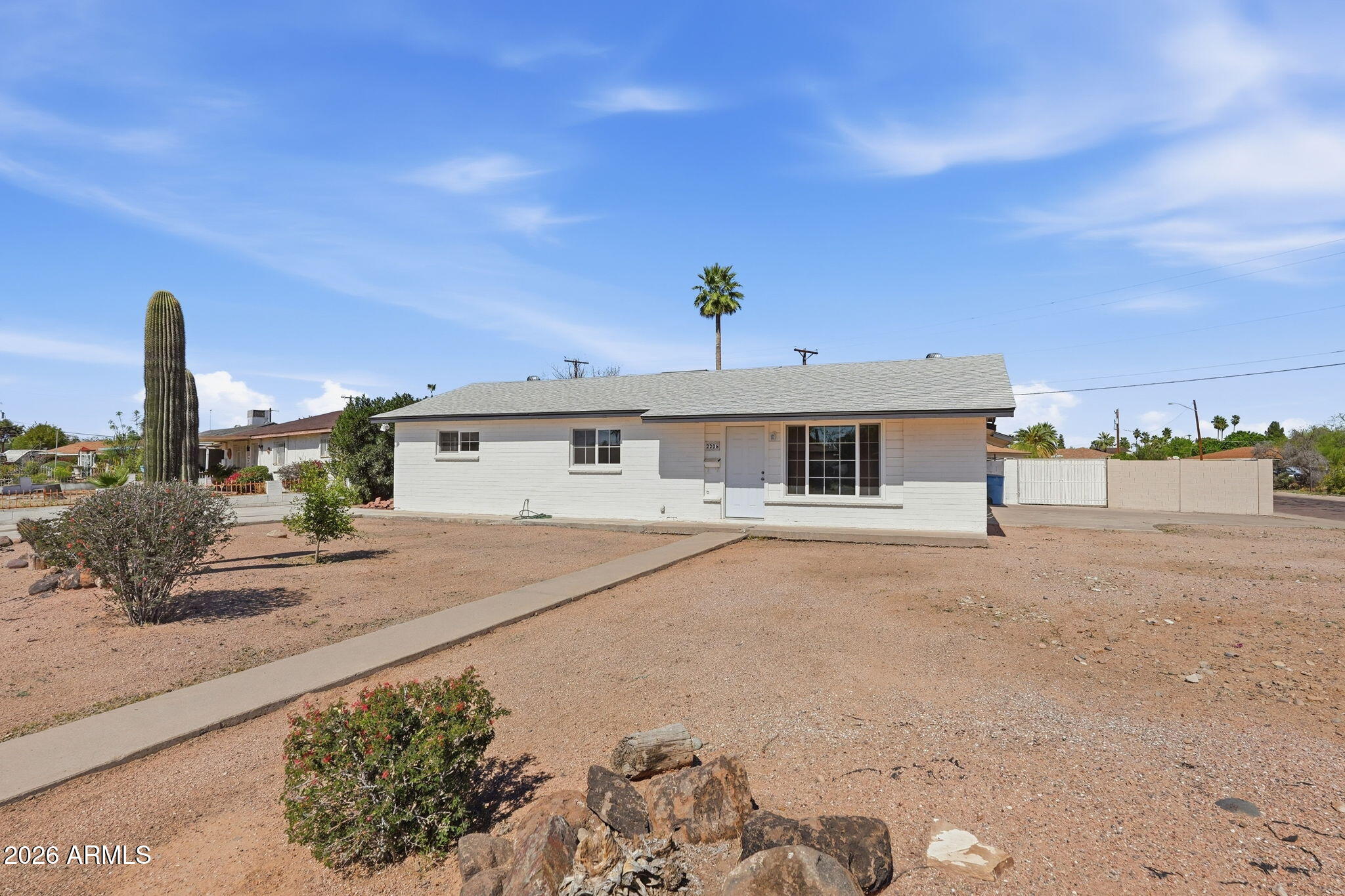 2206 West Rancho Drive Phoenix, AZ 85015 - Photo 29 of 29 a front view of a house with a yard