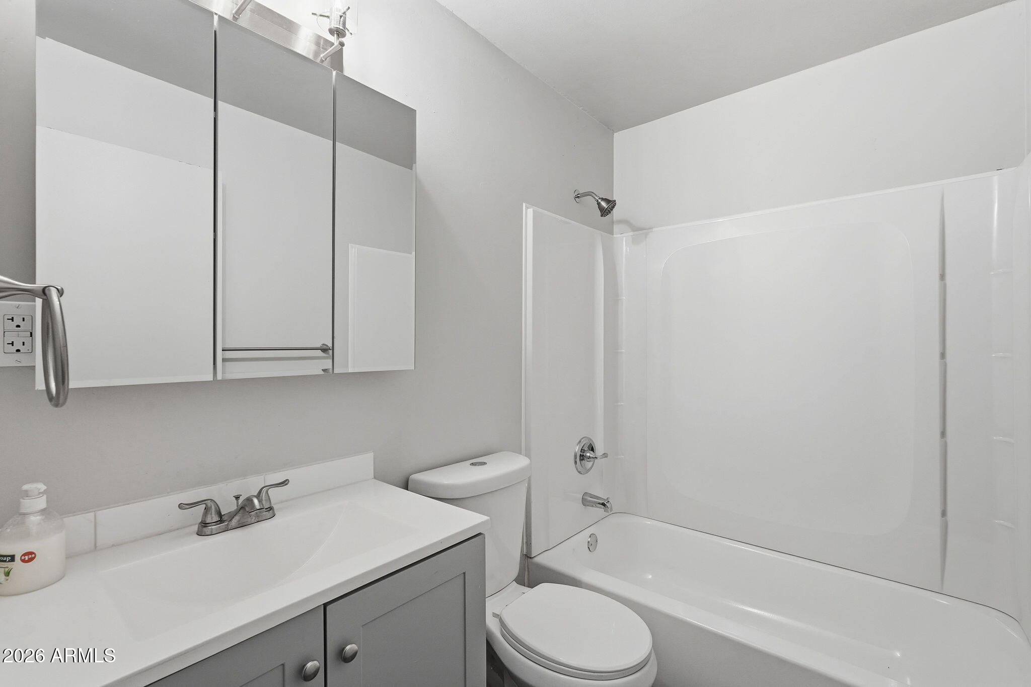 2206 West Rancho Drive Phoenix, AZ 85015 - Photo 7 of 29 a bathroom with a sink toilet and shower