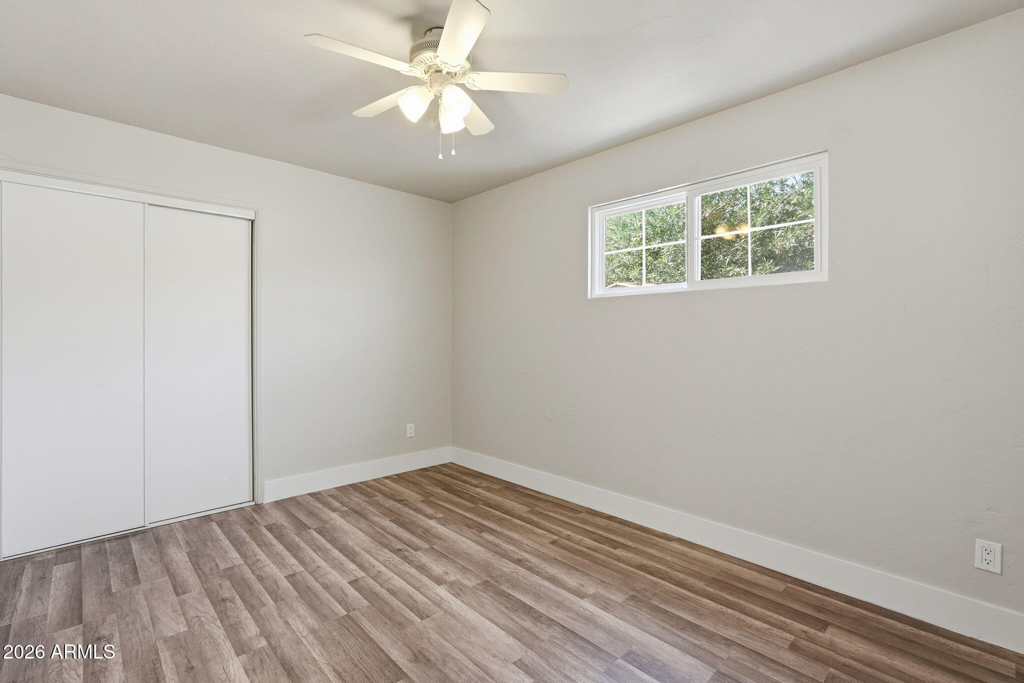 2206 West Rancho Drive Phoenix, AZ 85015 - Photo 9 of 29 an empty room with a window