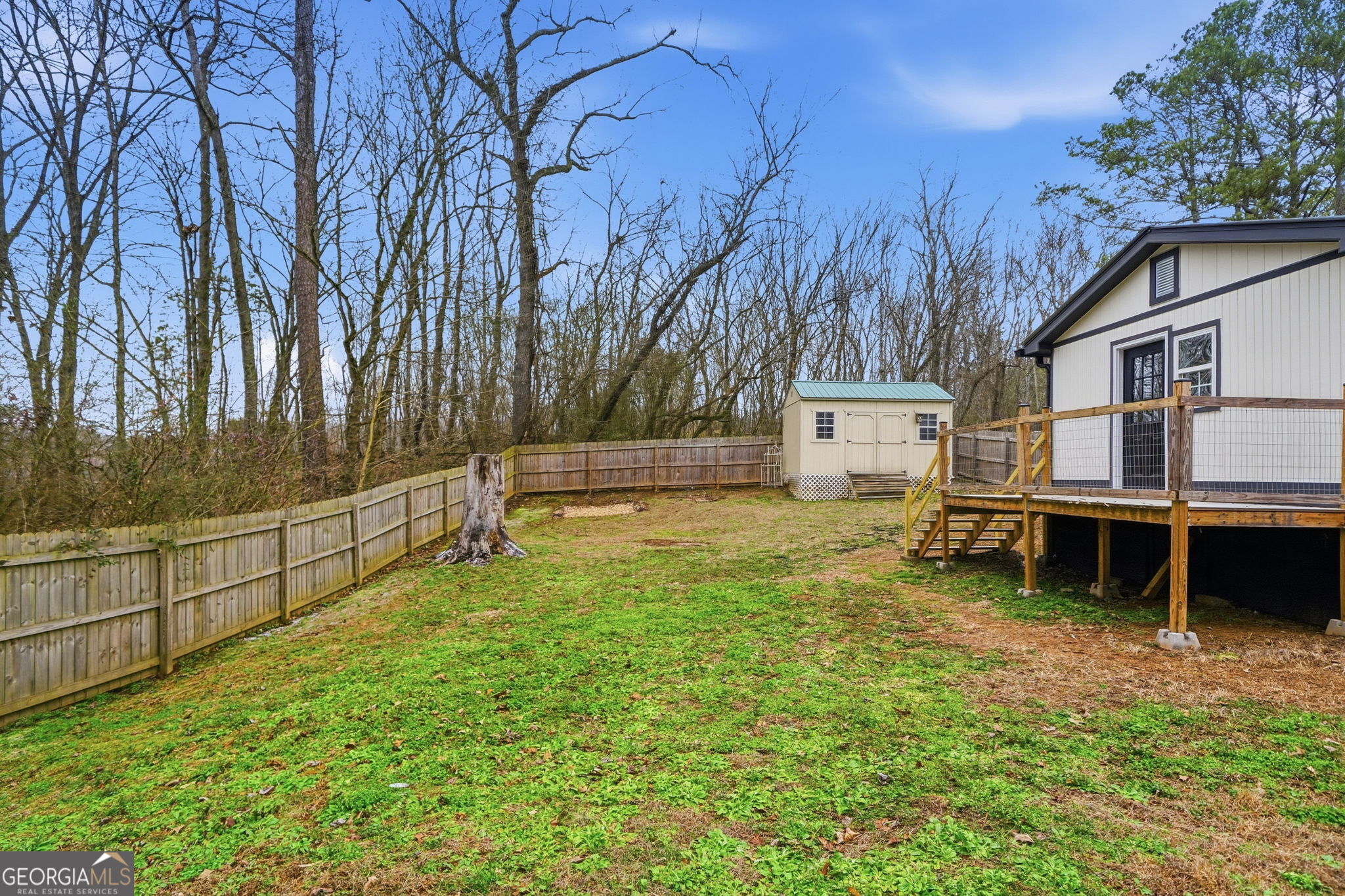 1734 Ball Ground Road Ball Ground, GA 30107 - Photo 11 of 31 a view of a house with backyard and trees