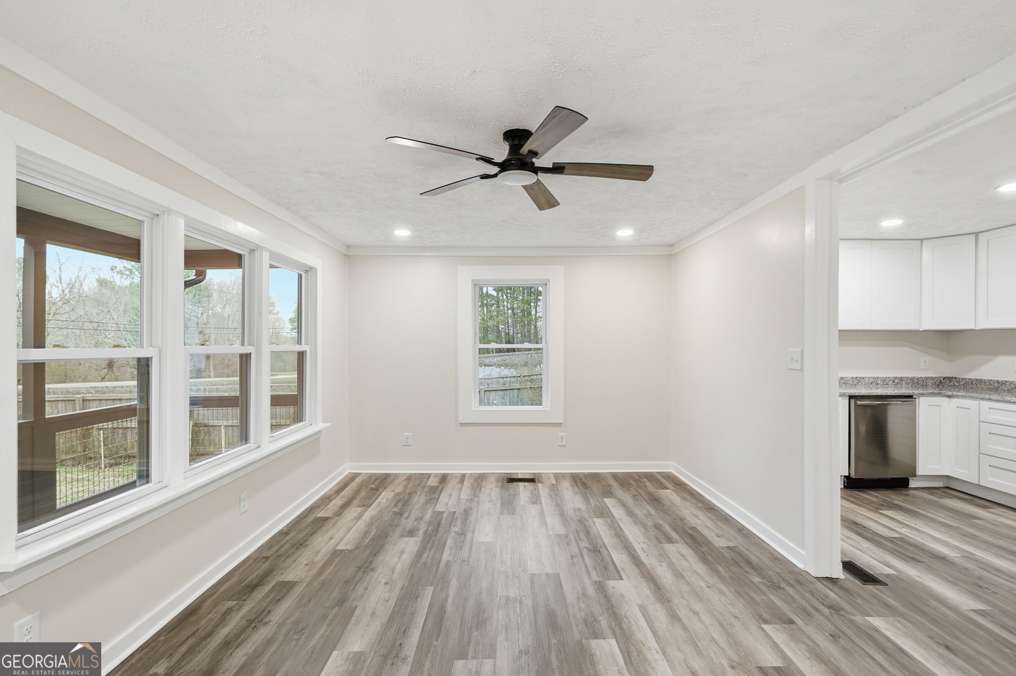 1734 Ball Ground Road Ball Ground, GA 30107 - Photo 14 of 31 a view of a room with a ceiling fan and a window