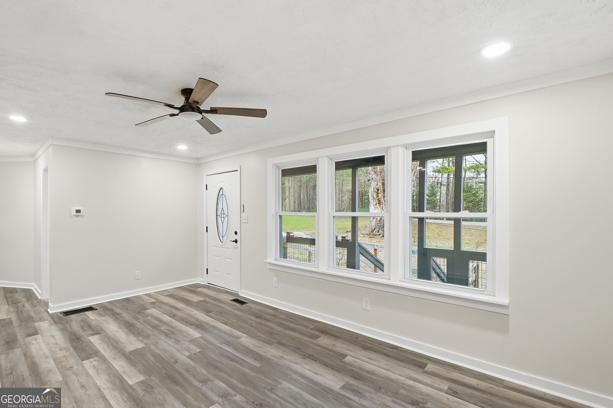 1734 Ball Ground Road Ball Ground, GA 30107 - Photo 17 of 31 a view of a big room with wooden floor and windows
