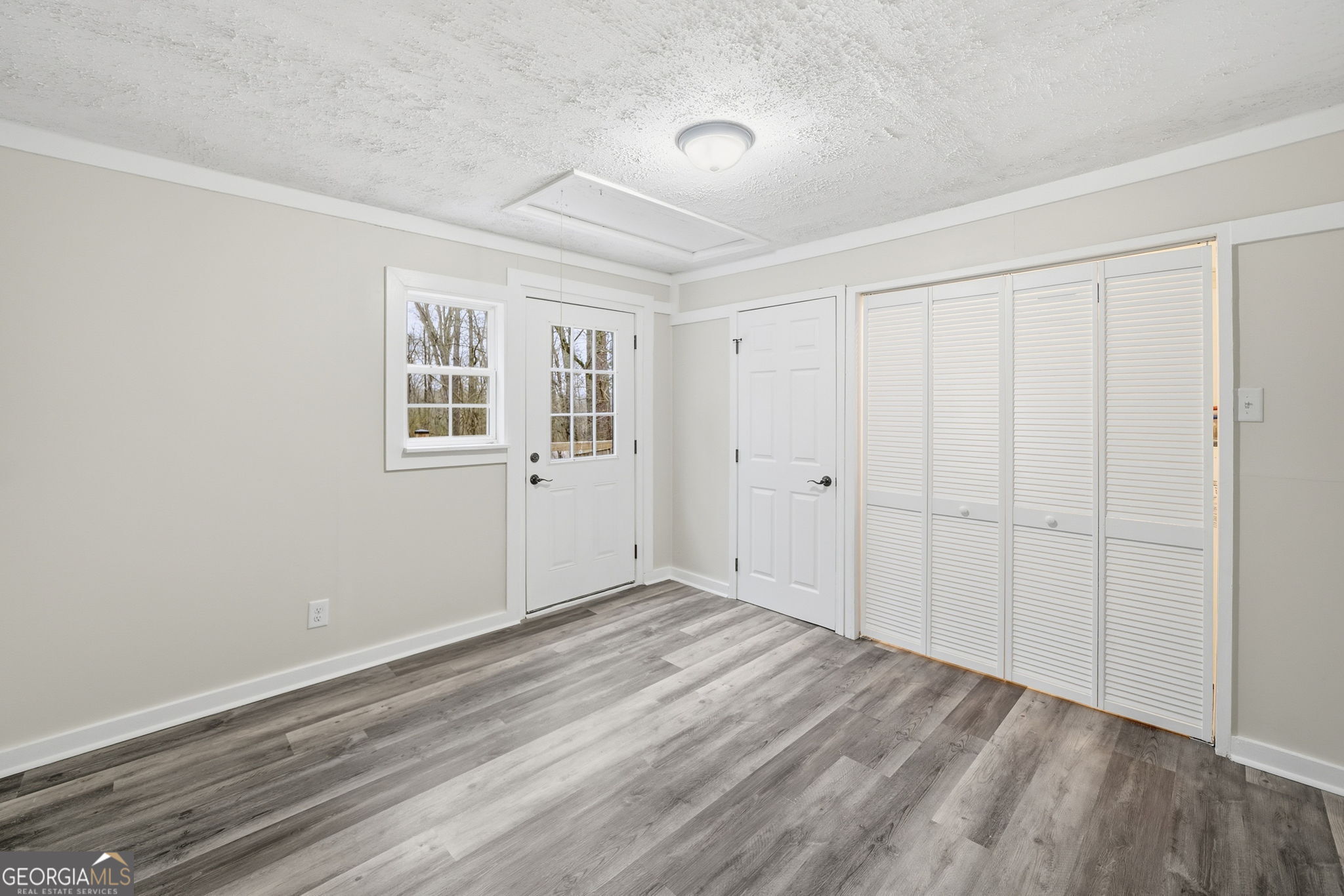 1734 Ball Ground Road Ball Ground, GA 30107 - Photo 21 of 31 wooden floor in an empty room