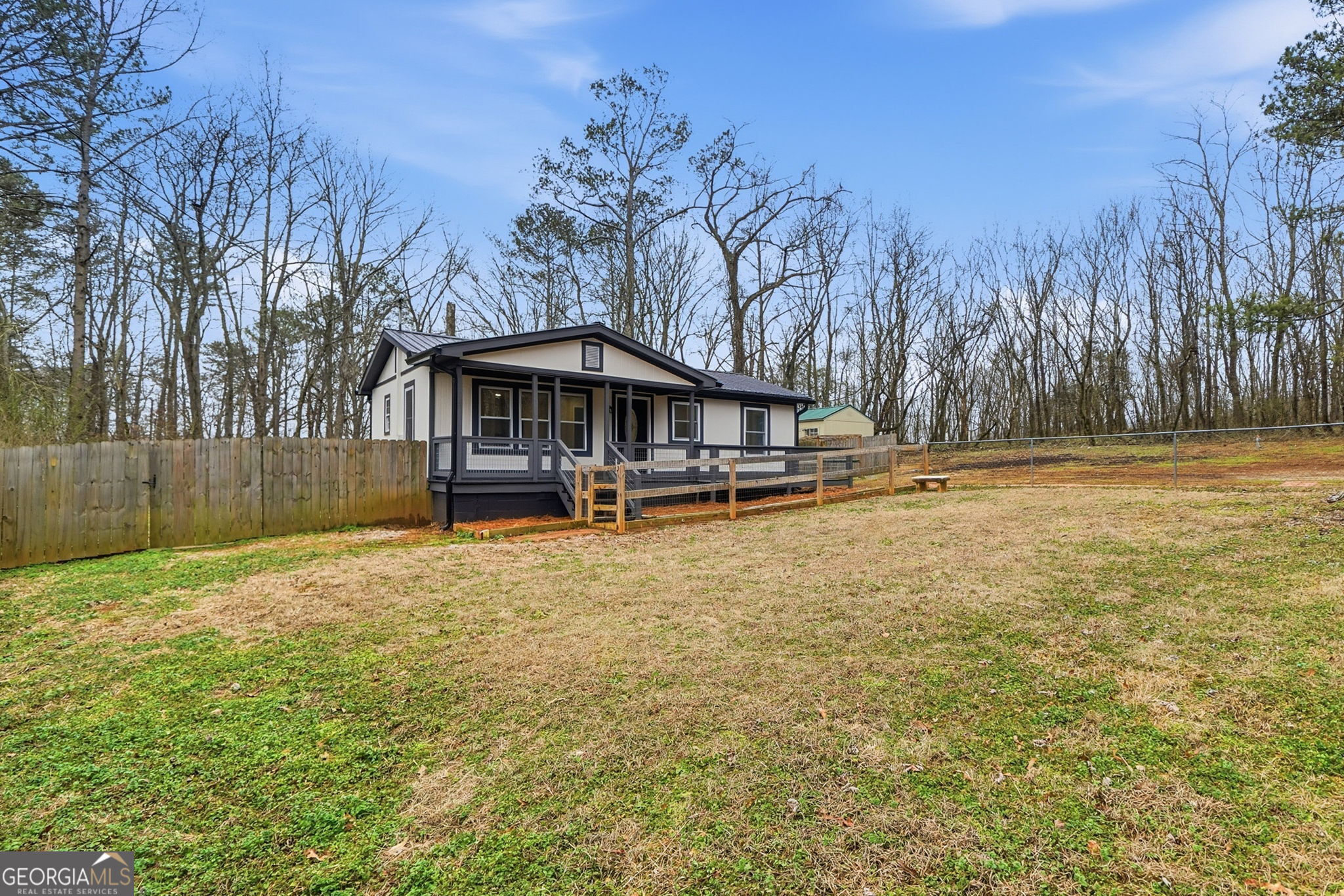1734 Ball Ground Road Ball Ground, GA 30107 - Photo 3 of 31 a backyard of a house with lots of green space and fountain