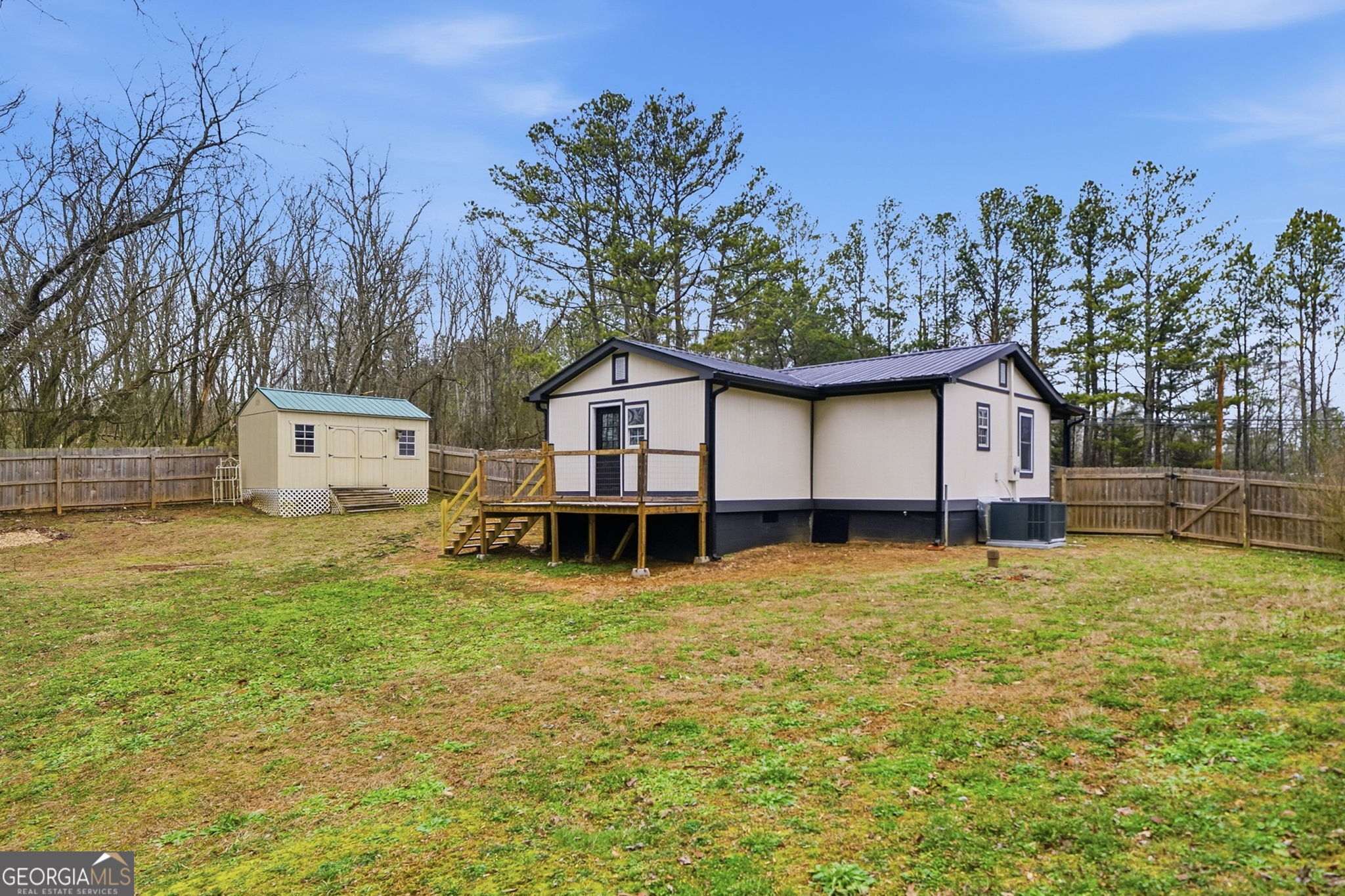 1734 Ball Ground Road Ball Ground, GA 30107 - Photo 10 of 31 a view of a house with a yard and large tree
