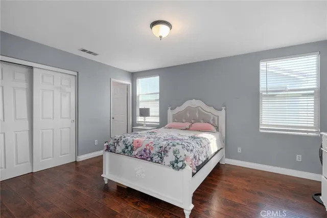 a bathroom with a sink vanity mirror and toilet