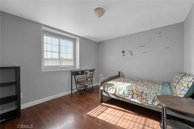 a bedroom with a bed and a view of bedroom